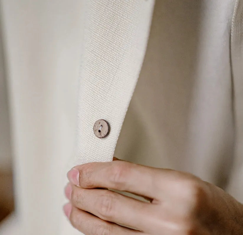 Men's light apricot shirt with botanical plant print and a Cuban collar.
