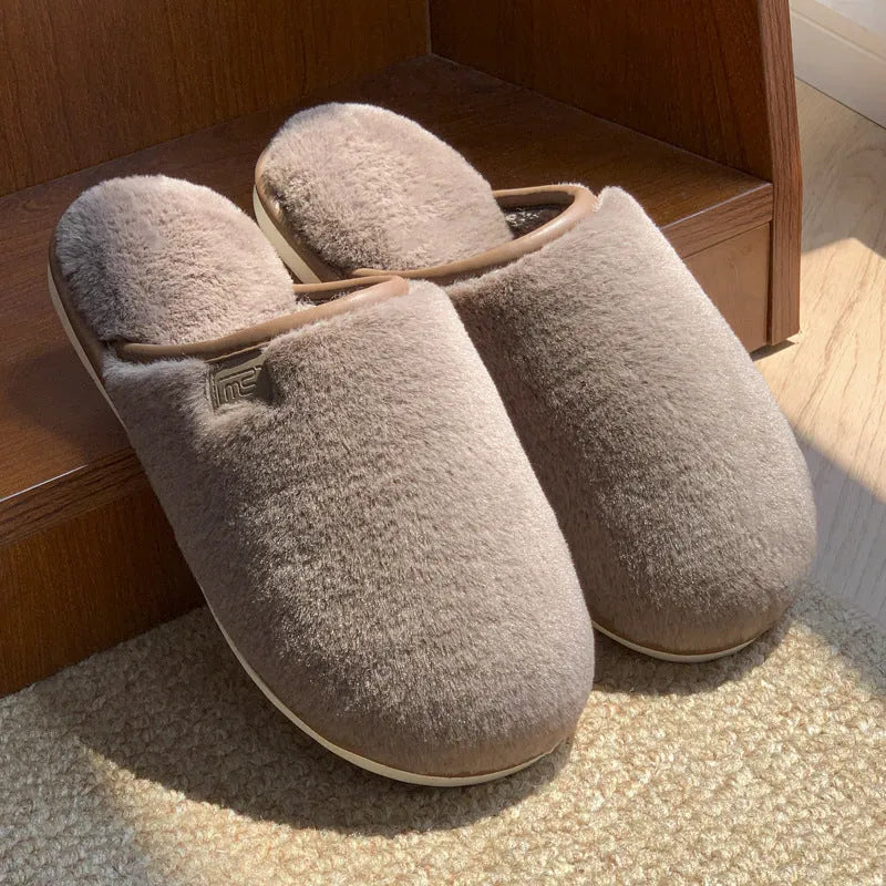 Winter plush slippers in solid colours with non-slip PVC soles and car stitching detail