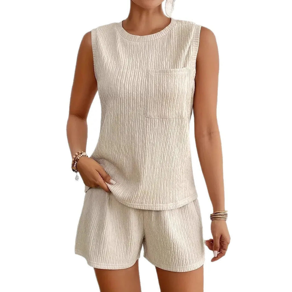 Women's apricot coloured sleeveless vest and elasticated waist shorts lounge set on a hanger.