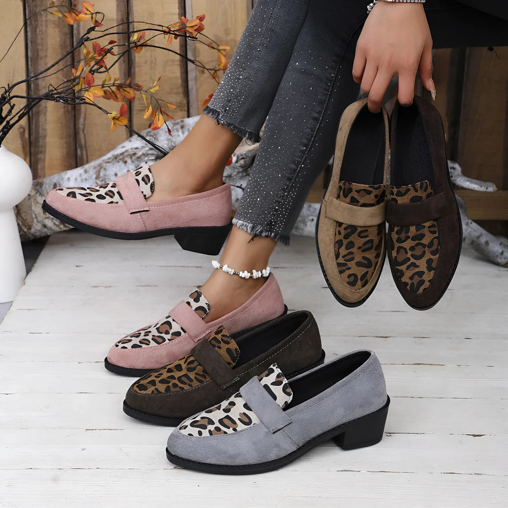 Leopard print suede slip-on pump with chunky heel in brown, shown from the side.