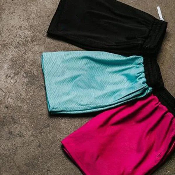 Men's mesh quick-drying shorts in solid colours for running and fitness.