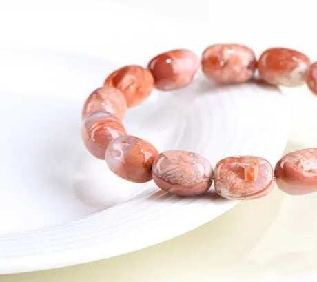 Natural cherry agate bracelet with 10x14mm barrel beads and traditional Ruyi design elements