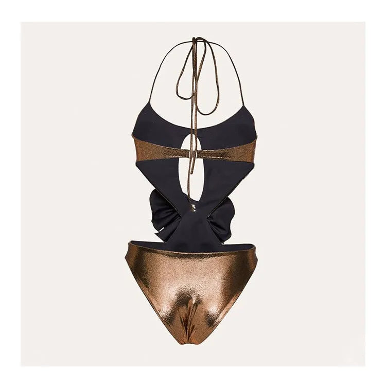 Gold coloured handmade one-piece swimsuit with halter neck and hollow out pattern.