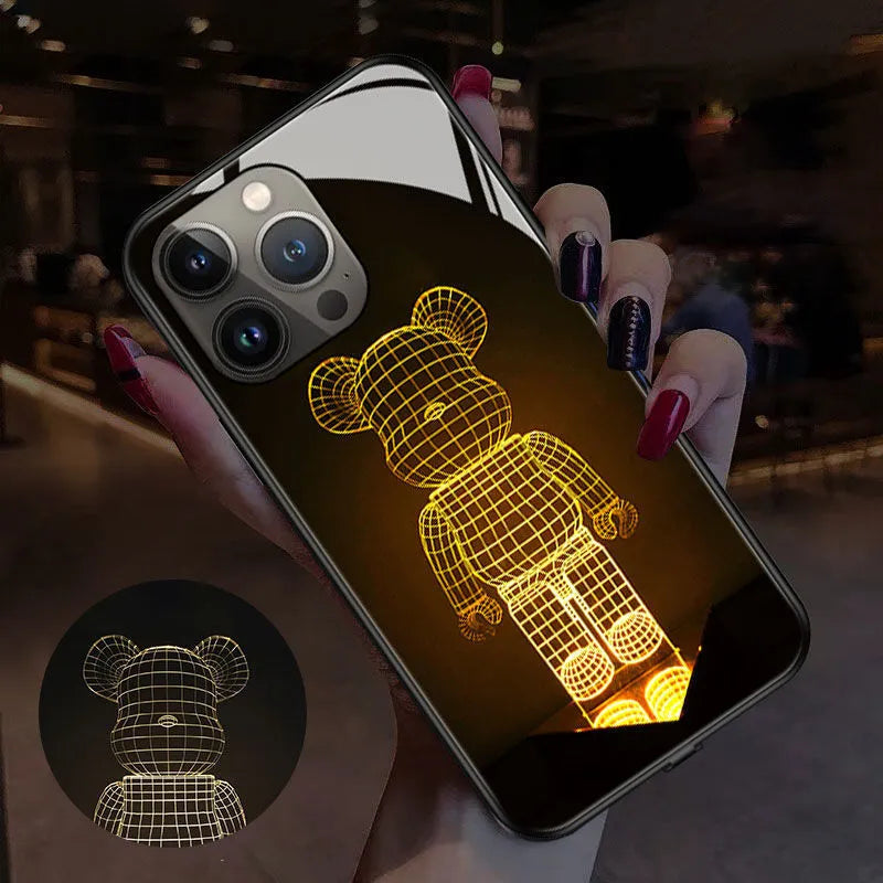 Transparent luminous iPhone case with tempered glass back shown on an iPhone.