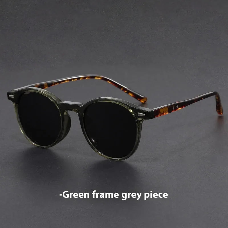 Retro oval sunglasses with ultra-lightweight round frame and polarised grey lenses.