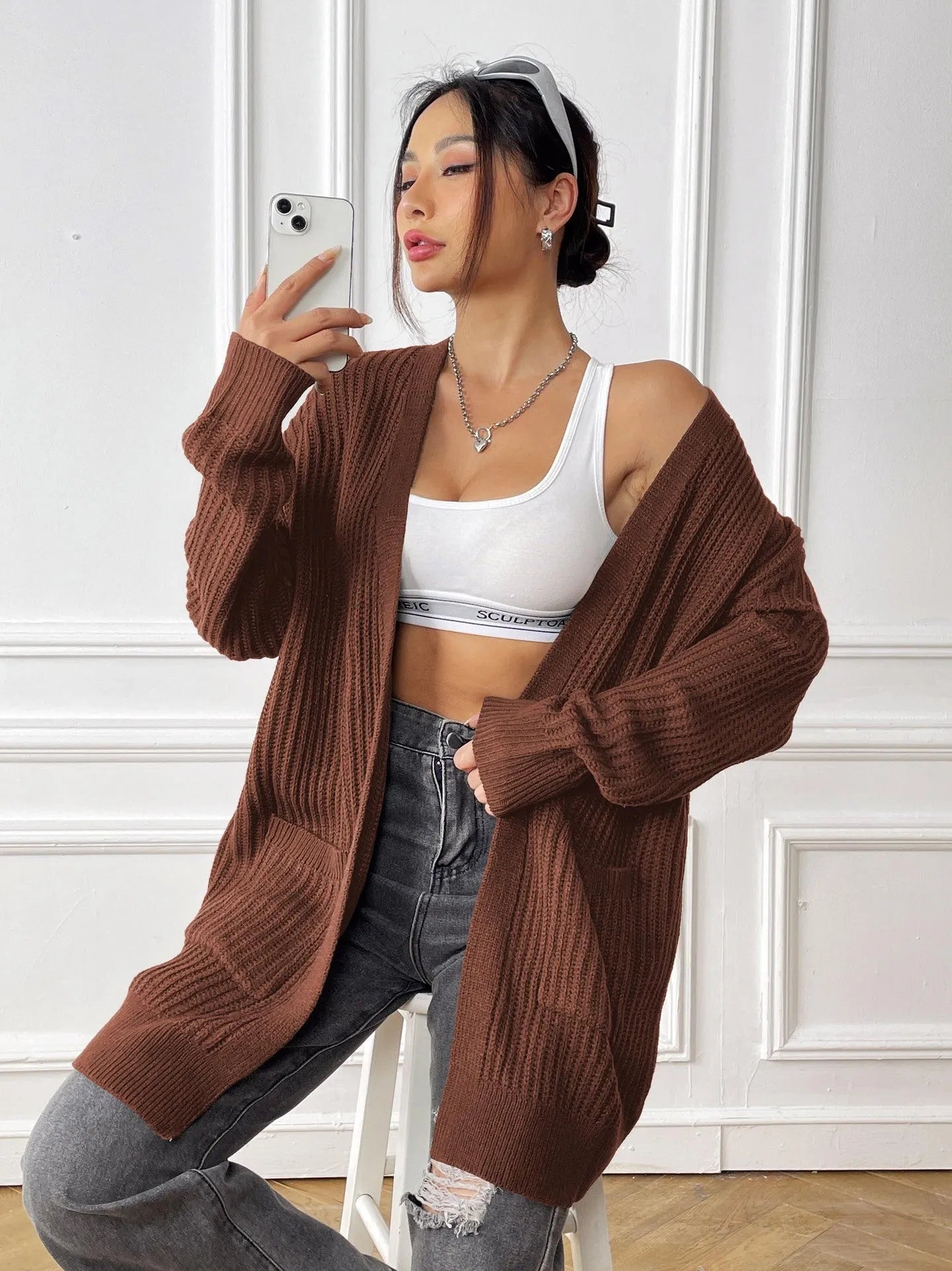 Women's mid-length loose fit cardigan with double pockets in dark green colour