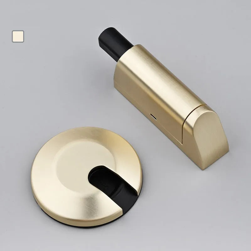 Zinc alloy invisible door stopper in brushed nickel finish on a wooden floor