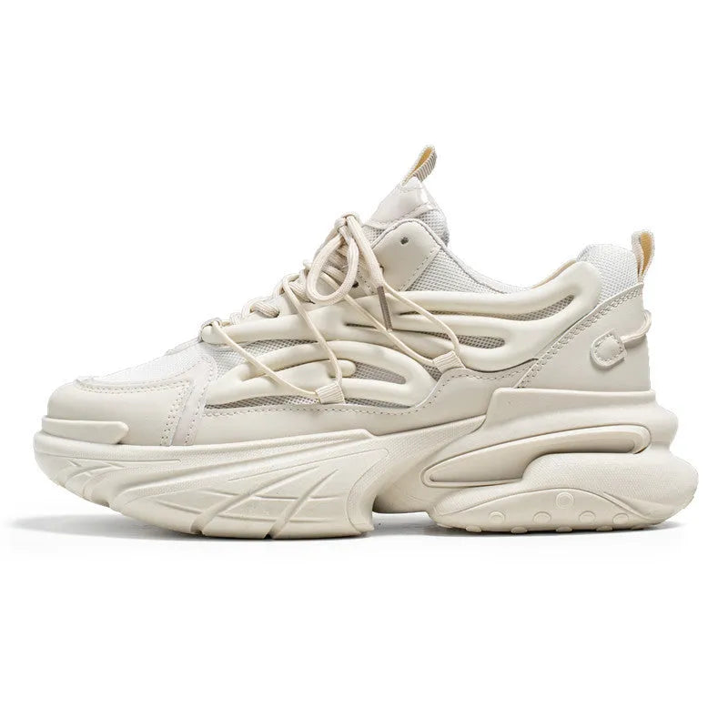 Men's beige and black low-top sneakers with mesh upper and rubber sole, showing lace-up front.