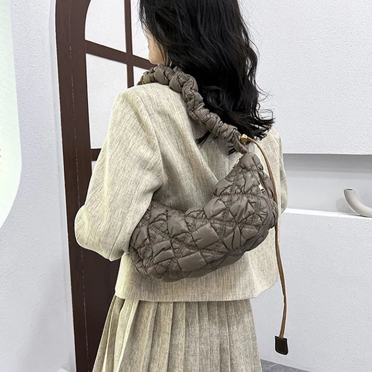 Women's nylon shoulder messenger bag in a solid colour with a long strap, showing front view.
