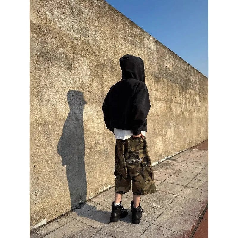 Men's camouflage cropped jeans with patch detailing and ripped accents in straight leg style