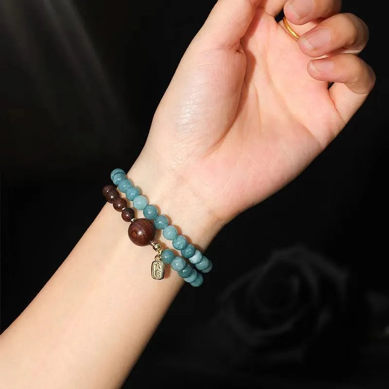 Natural stone blue gold sandalwood beaded bracelet for women with fu character and geometric design