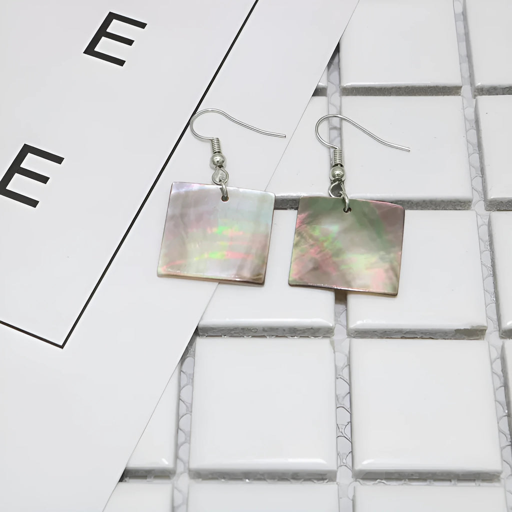 Women's geometric shell earrings with rectangular or square panther designs in natural colours