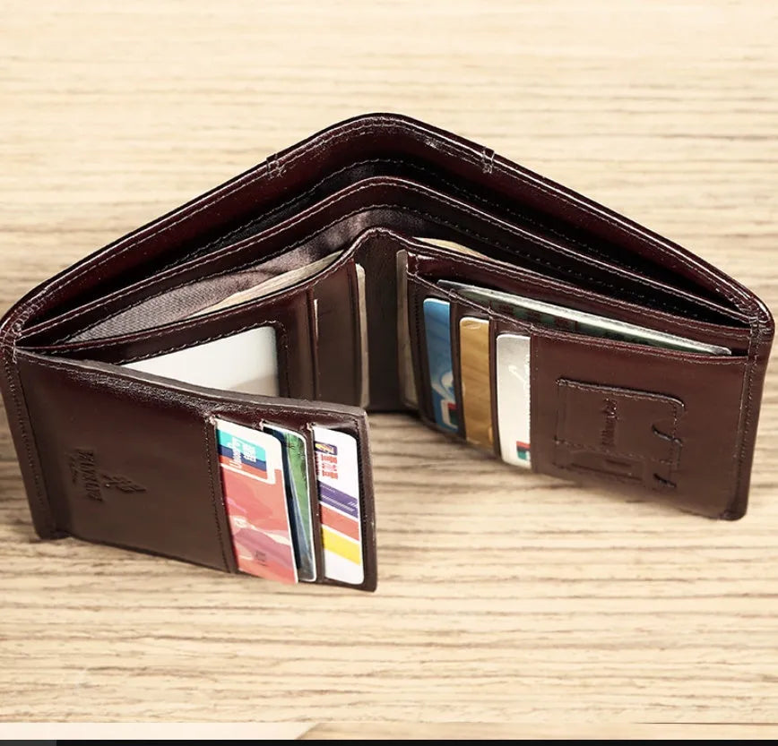 Men's black leather wallet open to show internal card slots, coin pocket, photo holder, and document section.