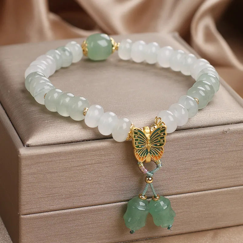 Green crystal women's bracelet with Tian Shan Cui abacus beads and retro butterfly tassel design