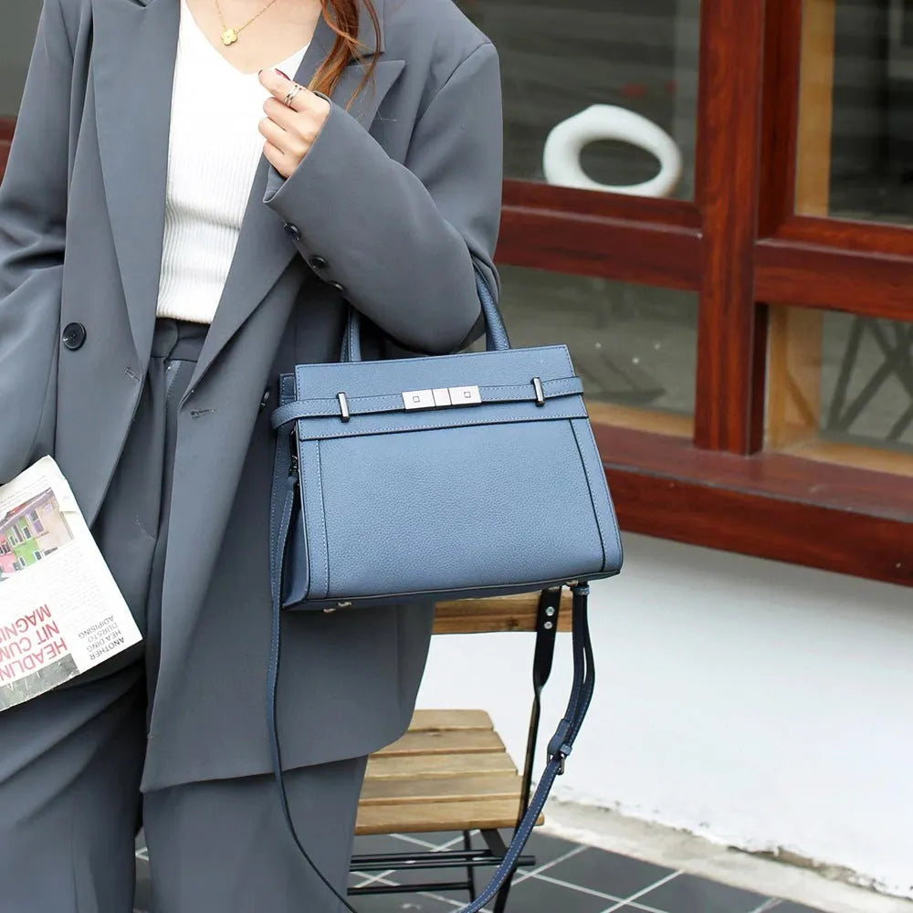 Small square genuine leather shoulder bag in neutral colour with internal organisation compartments