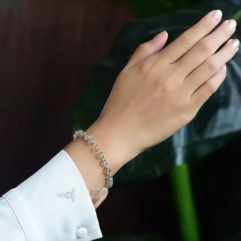 Women's 14K gilded bracelet with natural crystal blue moonstone gemstones in starry sky design