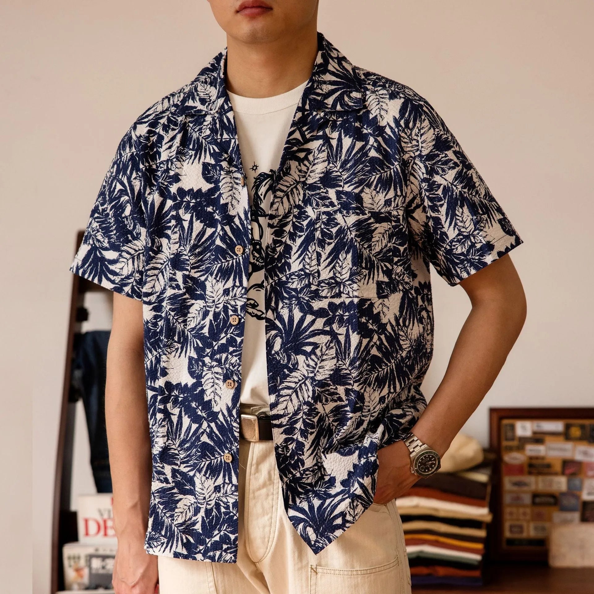 Man wearing a green vintage floral print seersucker shirt with a Cuban collar.