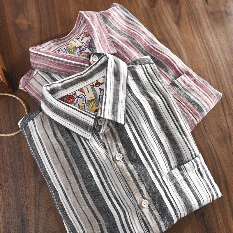 A man's casual red and grey striped linen shirt with long sleeves, laid flat to show its loose fit.