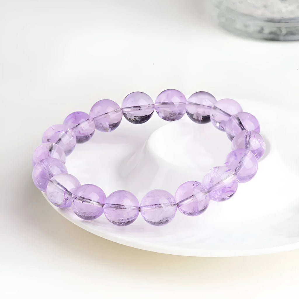 Amethyst crystal beaded bracelet with round lavender beads showing water ripple geometric pattern