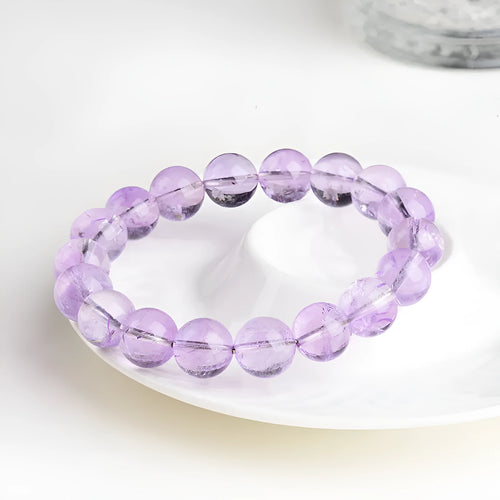 Amethyst crystal beaded bracelet with round lavender beads showing water ripple geometric pattern