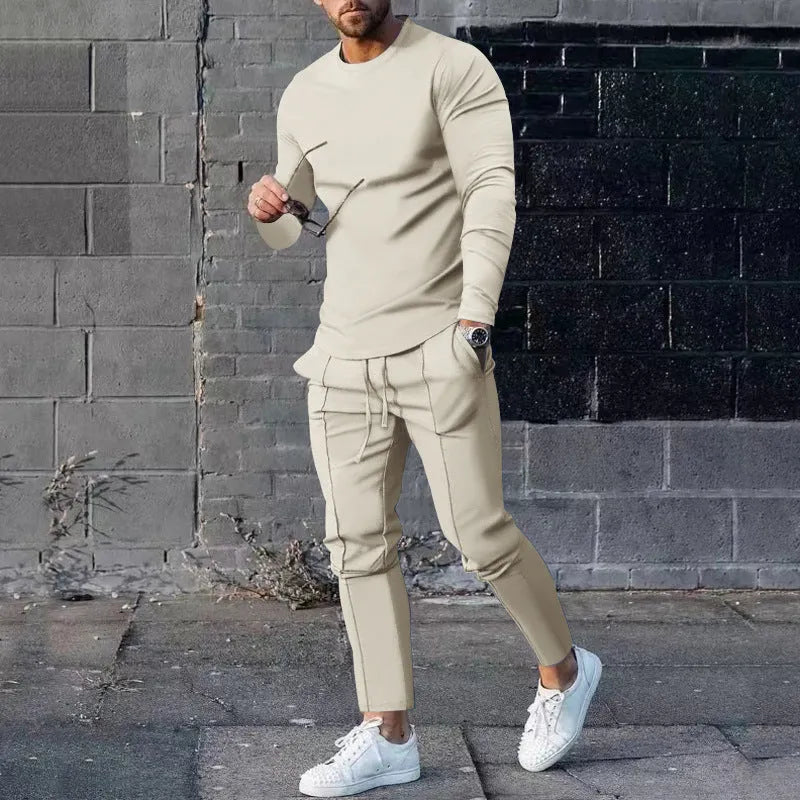 Men's solid colour two-piece polyester tracksuit with long sleeves, shown in apricot colour.