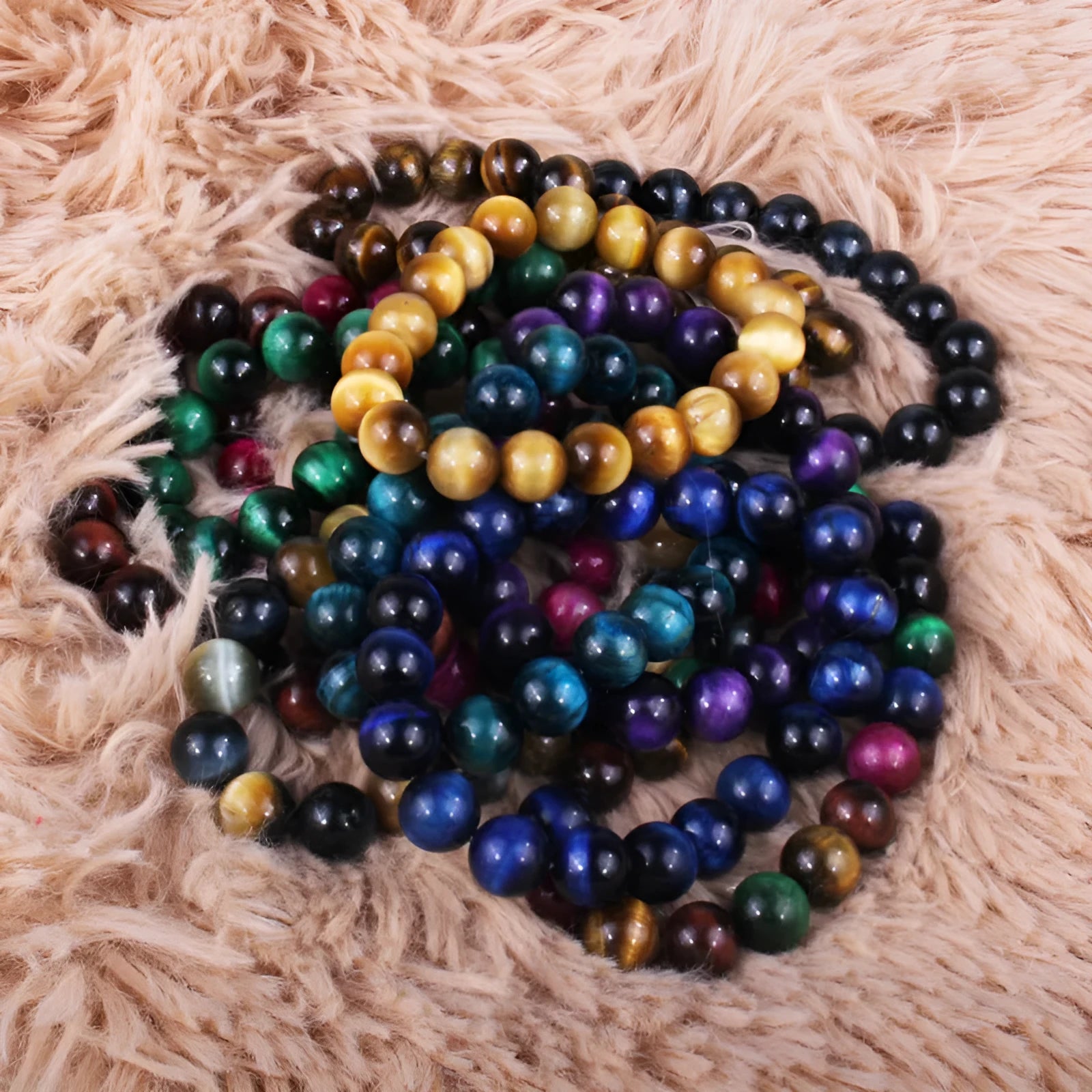 Unisex tigereye crystal bead bracelet with round geometric beads, shown in a dark blue variant.