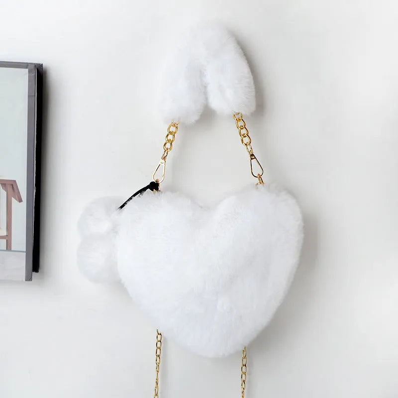 Soft plush heart-shaped women's handbag in medium size with zipper closure