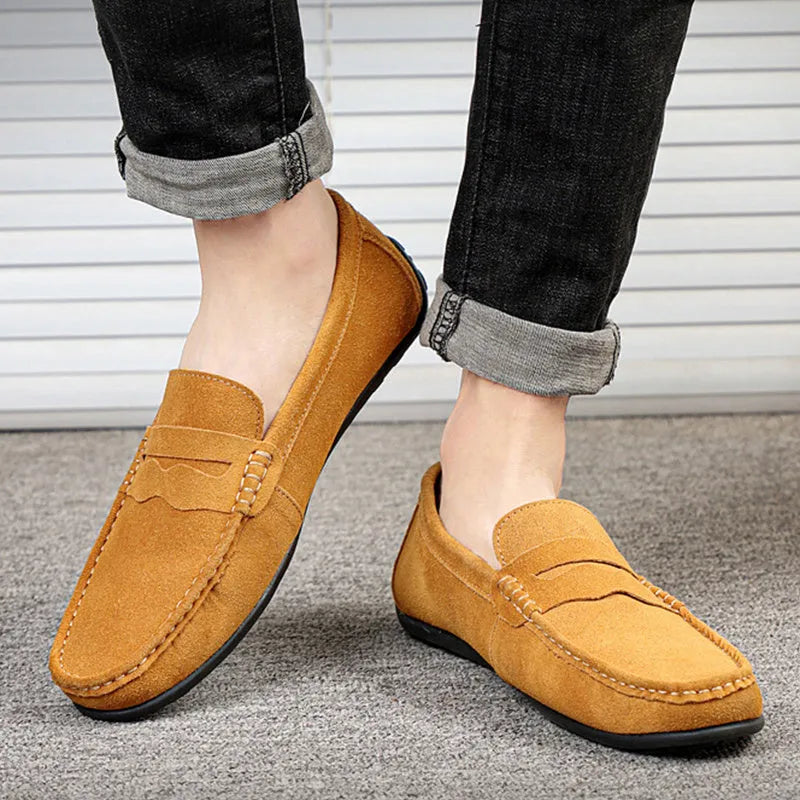 Men's suede loafers in black, blue, dark blue, wine red, and yellow colours showing round toe and flat sole