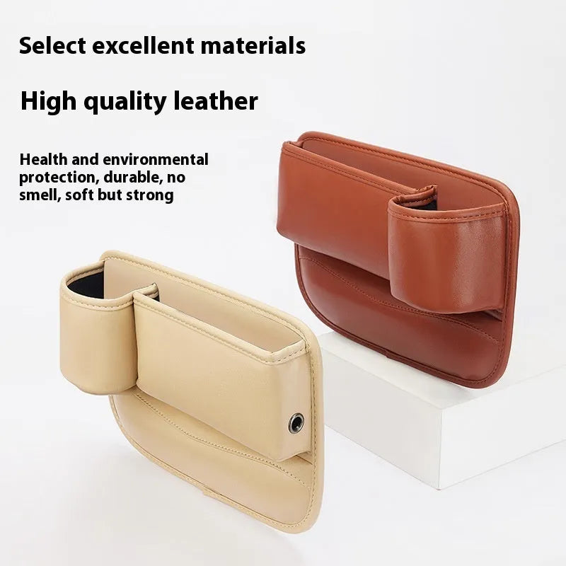 Car seat gap storage box with water cup holder in black leather beside driver seat