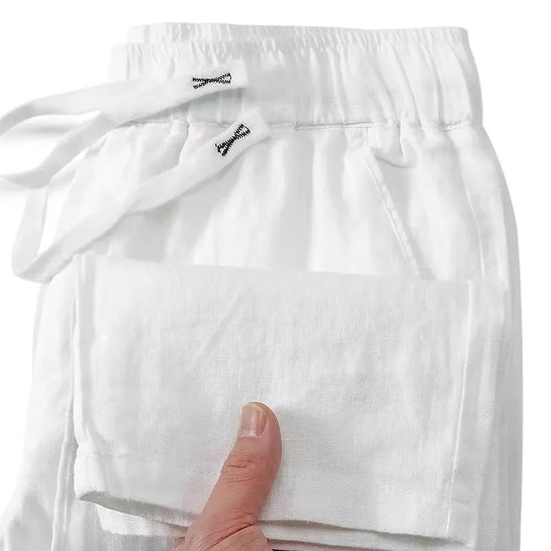 Pure linen Chinese-style straight leg trousers with a drawstring waist in apricot colour.