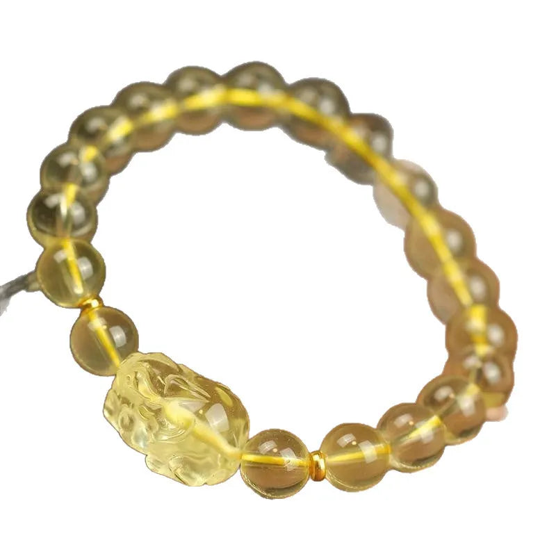 Yellow leather strap Citrine Pi Xiu bracelet with round artificial crystal beads in national folk style.