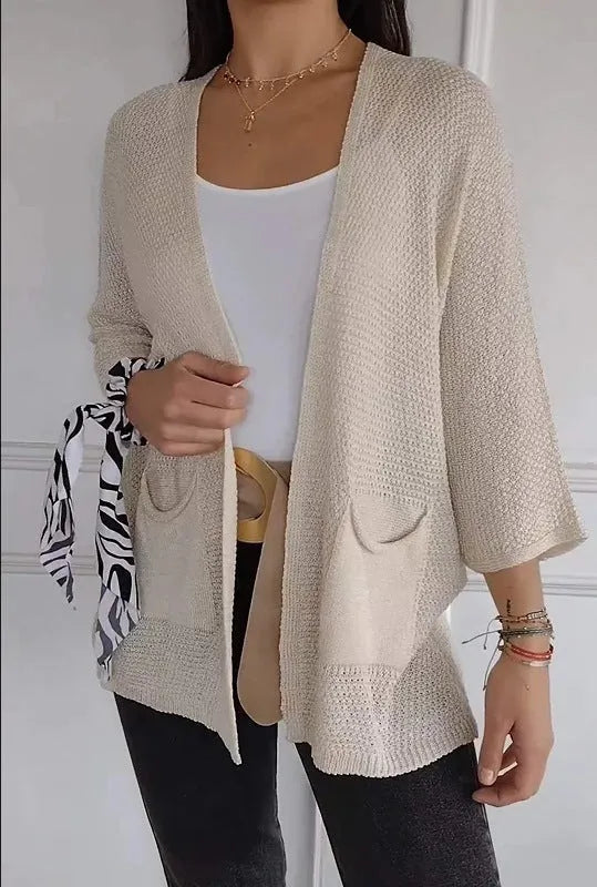 Women's thin waffle weave cardigan coat in army green with nine-quarter sleeves and pockets.