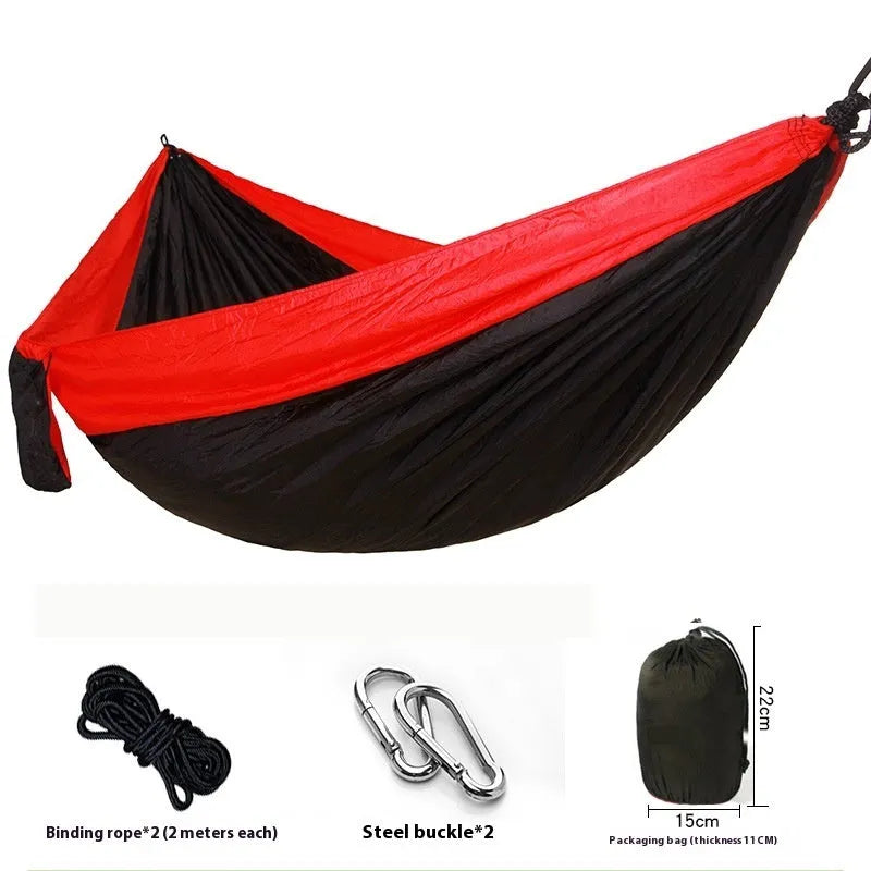 Double camping hammock with ropes and buckles shown in outdoor setting