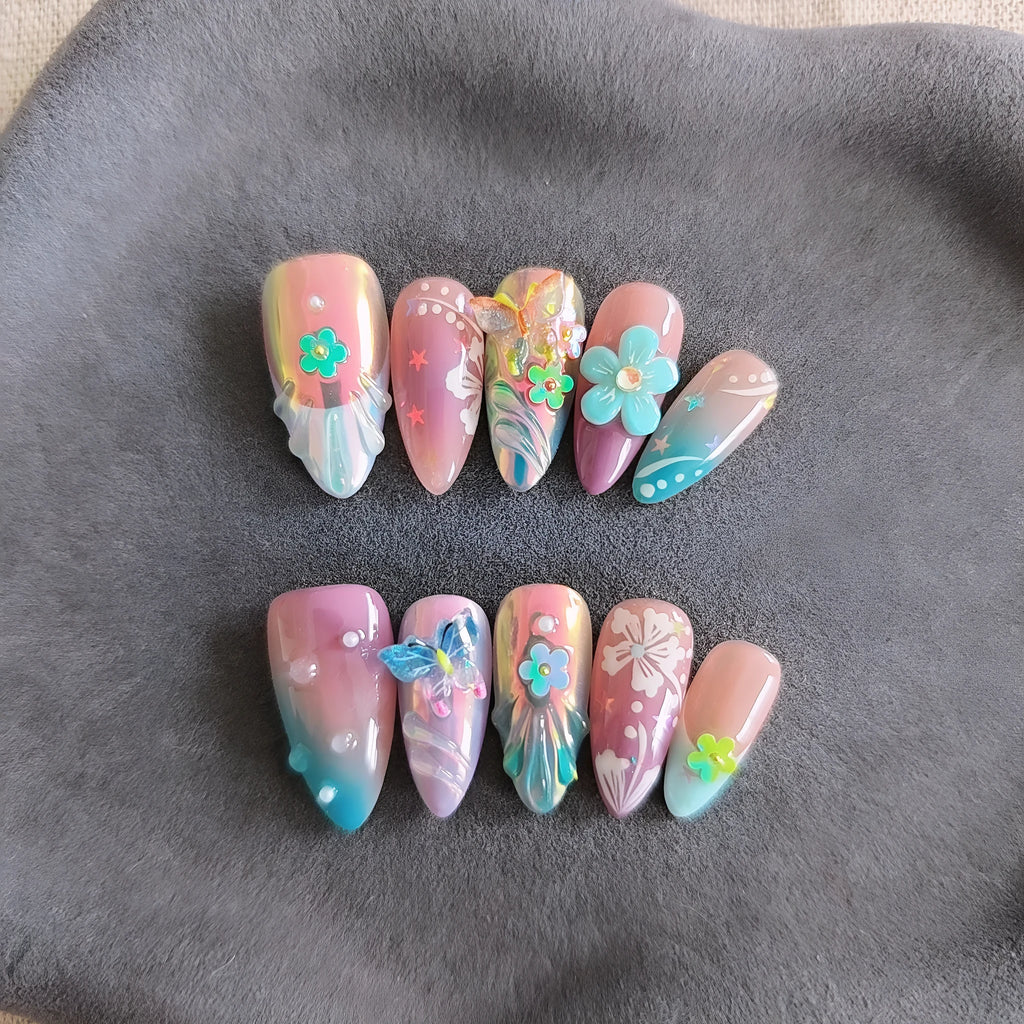 Handmade colourful nail sculpture set with small flower and butterfly designs in four sizes