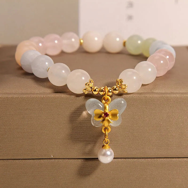Crystal bracelet with natural Morganite butterfly pendant charm in candy colours on adjustable band