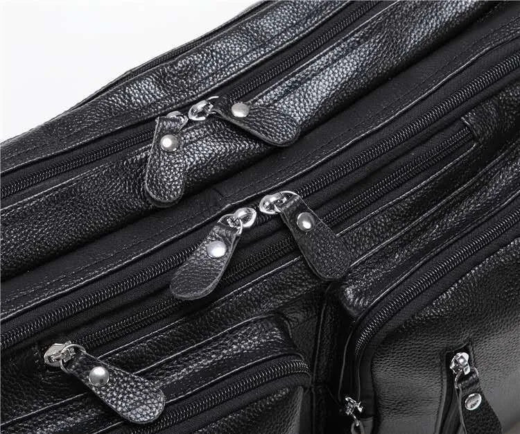 Black large leather handbag horizontal square shape with zipper closure and multiple internal compartments