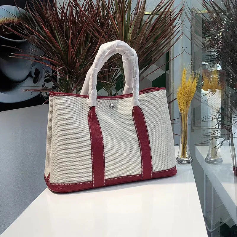 Genuine leather women's crossbody tote bag with canvas texture in bucket shape