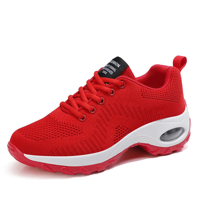 Red and black women's low-top mesh sneakers with round toe and front lace-up closure.