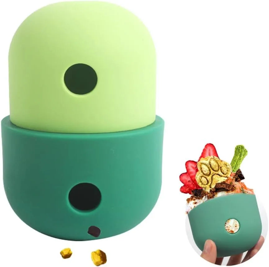Two-tone silicone dog treat dispensing puzzle ball for small medium dogs on a wooden floor