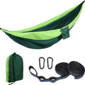 Double camping hammock with ropes and buckles shown in outdoor setting