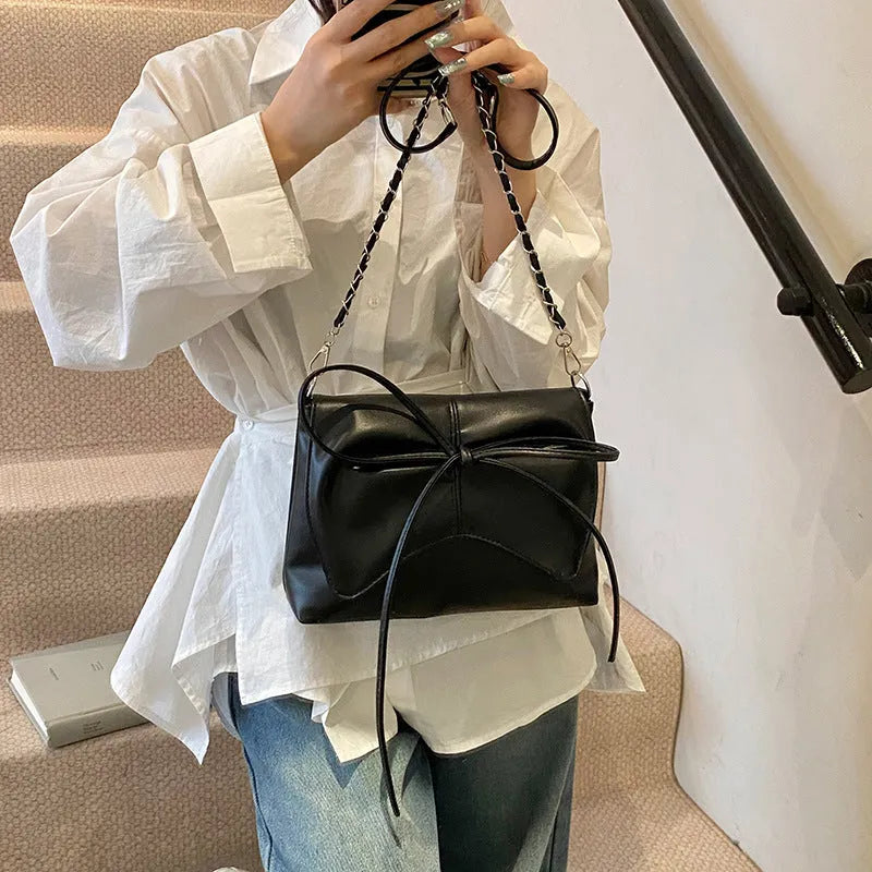 Women's black PU leather crossbody underarm bag with horizontal square shape and sewing line detail