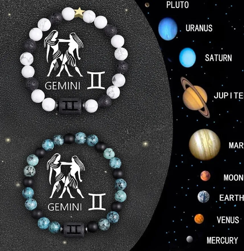 Two natural stone beaded zodiac bracelets with adjustable strings on wooden surface