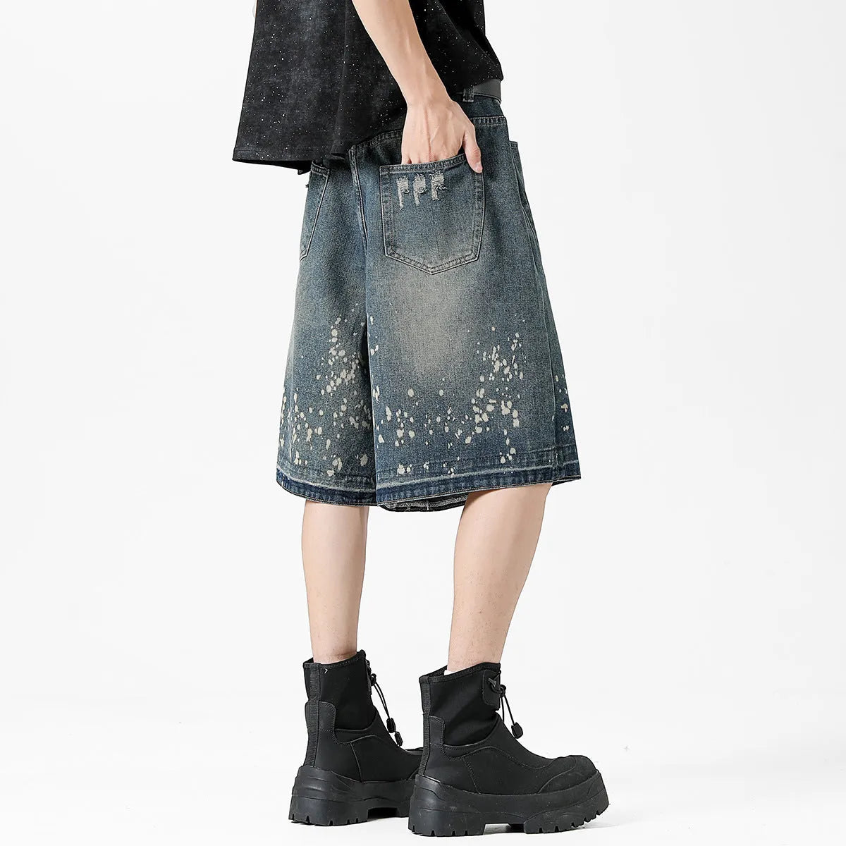 Men's retro blue denim shorts with splash ink pattern and ripped straight-leg design