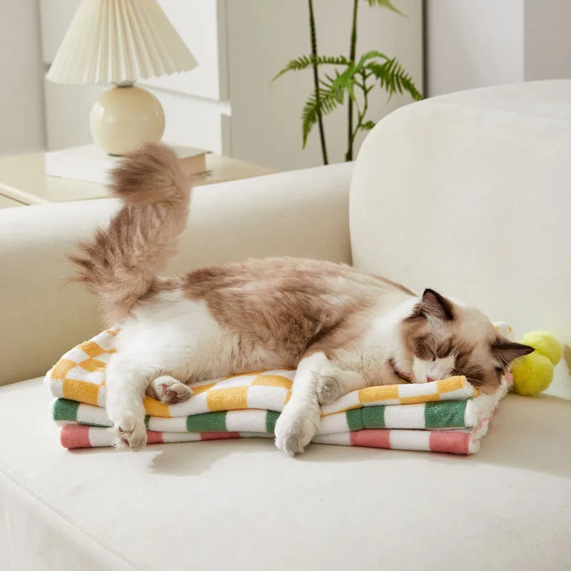 Plaid pattern pet blanket with fur ball decorations in green, pink or yellow colours