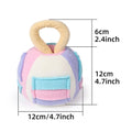 Pink and green plush ball dog toy with squeaker and treat pockets on a white background.
