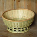 Handmade natural bamboo storage basket set showing three different sizes for household organisation
