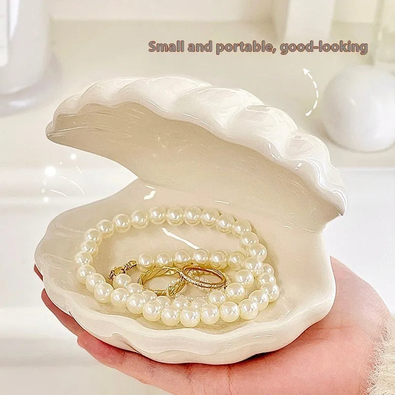Yellow ceramic ornament tray with a small pink-shell night light placed on it, modern simple style.