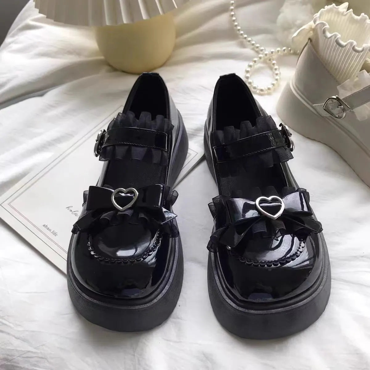 Mary Jane platform shoes for women with wedge heel on a plain background