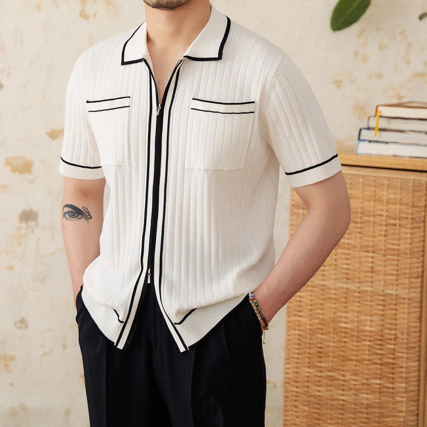 Men's slim fit black lapel polo shirt with short sleeves on a hanger