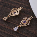 Small water drop-shaped pendant with hollow crown design and micro-inlaid zircon details.